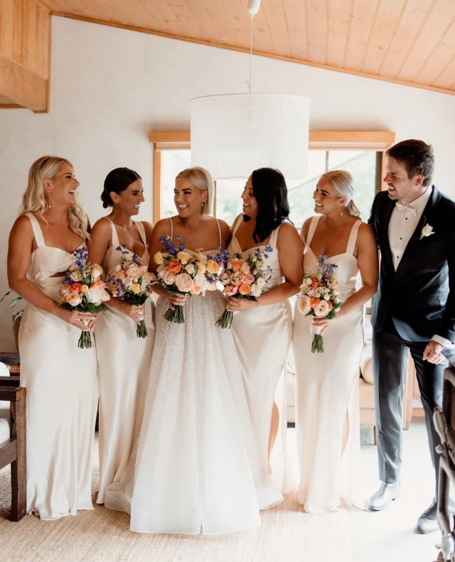 Scrolling Insta looking for amazing florals for your wedding? Well we're happy to report that you've found them! Say hello to @basiapuchalskifloraldesign.⁠
⁠
No detail is too small for this flower expert; from bouquets and buttonholes to full event arrangements, she has everything you’ll ever need. Just take a look at these gorgeous bouquets from Phoebe & Aaron’s featured wedding (swipe for a closer look!). ⁠
⁠
As an award-winning floral design specialist with over 15 years of experience in the wedding industry, Basia is your one-stop shop for all things florals. ⁠
⁠
Find out more about her incredible business on the Polka Dot Directory. Link in bio!⁠
⁠
And if you’re a wedding vendor, you should sign up for a Polka Dot Membership! See the perks at the link in our bio.⁠
⁠
Photographer: @clairedavie / Florals: @basiapuchalskifloraldesign⁠
⁠
[Image one description: This bridal party are standing together after getting ready, holding their pastel bouquets. Four bridesmaids stand on either side of the bride, wearing soft cream gowns, while the bride herself is wearing a sparkling gown. To the right of the bridesmaids stands a bridesgroom, wearing a classic black suit.⁠
⁠
Image two description: Here we can see the stunning glitter from the brides gown, as well as the soft peachy tones of the bouquet with vibrant pops of blue.]⁠
⁠
#PolkaDotWedding #FeelGoodWeddings #AustralianWeddings #AustralianWedding #WeddingVendors #WeddingDirectory #WeddingFlorist #WeddingFlowers #WeddingFlorals #WeddingWebsite #WeddingInspo #WeddingInspiration #WeddingBlogger