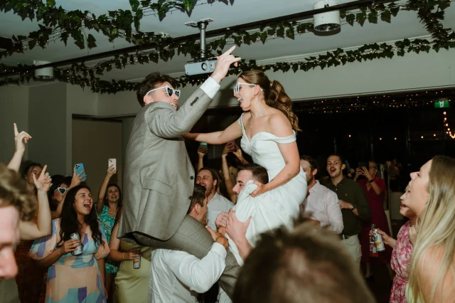 Ready to PACK your wedding dance floor? Today on Polka Dot Wisdom, we’ve got you covered with top picks from the amazing @bakerboysband ⁠!⁠
⁠
From classic bangers like Whitney's “I Wanna Dance With Somebody” to modern hits like Dua Lipa's “Dance The Night”, this playlist will have everyone on their feet. Perfect for those who want good vibes, full dance floors, and unforgettable memories. ⁠
⁠
Check out the full list and tips via the link in our bio. ⁠
⁠
Photography: @bakerboyscreative⁠
⁠
[Image description: A joyful wedding reception scene where the bride and groom are being lifted on the shoulders of their guests in the middle of a crowded dance floor. The bride, wearing an off-the-shoulder white gown and heart-shaped sunglasses, laughs as she reaches toward the groom, who is wearing a light grey suit and matching sunglasses. Around them, guests cheer, dance, and take photos with their phones. The ceiling is decorated with greenery and fairy lights, adding to the festive atmosphere.]⁠
⁠
#PolkaDotWedding #FeelGoodWeddings #AustralianWeddings #AustralianWedding #PolkaDotWisdom #WeddingPro #WeddingVendor #WeddingProfessional #WeddingInterview #WeddingInspiration #WeddingInspo #WeddingMusic #WeddingReception #WeddingParty