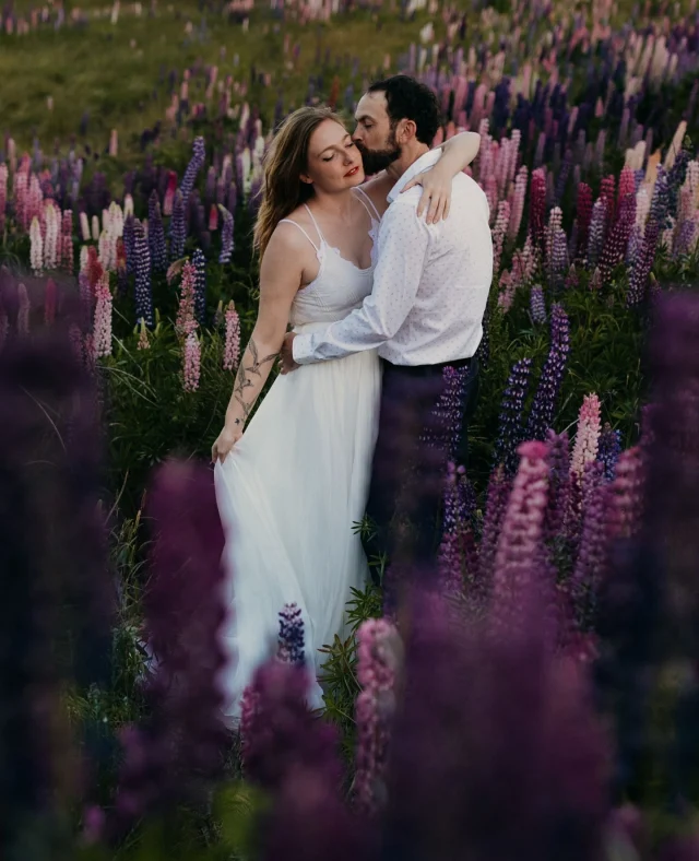 “Keep dating each other, even long after you’re married.” – @aimeeflynnphoto⁠
⁠
Ten years after saying “I do,” Rob and Aimee returned to one of their favourite places on earth – the breathtaking landscapes of New Zealand – for a romantic vow renewal! With vows made barefoot by the river and captured beautifully by @adventureandvow, this one has us swooning!!⁠
⁠
Read their full story now on Polka Dot Honeymoons – link in bio.⁠
⁠
Photographer: @adventureandvow / Bride’s Dress: @dearheartbride / Bride’s Jewellery: @anthropologieweddings / Bride’s Shoes: @redwingheritage / Bride’s Veil/Hair Accessories: @twigsandhoney / Wedding Cake: @fergbakerqueenstown / Alterations: @kingweddingalterations⁠
⁠
[Image one description: Embracing in a field of vibrant purple lupines, Aimee is wearing a floaty silver gown with thin straps, and Rob is wearing brown pants and a white spotted shirt.⁠
⁠
Image two description: Aimee is holding her flowing skirt up to blow in the wind behind her as she faces away from the camera. In front of her, Rob gazes lovingly at her, and picturesque mountains lined with snow take up the background.⁠
⁠
Image three description: Rob and Aimee share a sweet treat, Lady and the Tramp style. Aimee is wearing Rob’s dark blue jacket.]⁠
⁠
⁠
#PolkaDotWedding #PolkaDotHoneymoons #FeelGoodWeddings #Honeymoon #HoneymoonIdeas #Honeymoons #Honeymooning #HoneymoonVibes #HoneymoonDiaries #LuxuryTravel #LuxuryHoneymoon #Travel #Travelling #TravelIdeas #QueenstownVowRenewal #VowRenewal