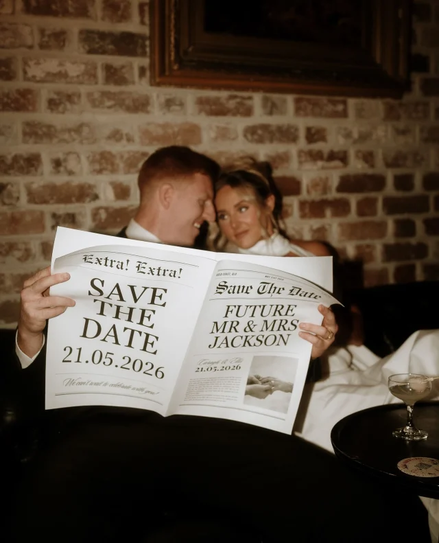Ellis & Caragh didn’t just want pretty photos...⁠
⁠
They wanted something that would feel timeless. Something they would show their grandchildren decades from now. And with moody tones, a custom newspaper, and vintage flair, their “save the date” shoot is as heartfelt as it is stylish!⁠
⁠
It’s all on Polka Dot Featured today — and it’s a must-see!⁠
⁠
Photographer: @candid_chaser / Venue: @merivale⁠
⁠
[Image one description: Sitting against a rustic brick wall, this couple are holding a newspaper in front of them, staring lovingly into each other’s eyes. The newspaper reads “Extra! Extra! Save the date. Future Mr & Mrs Jackson.⁠
⁠
Image two description: Now the couple are playing pool, with Ellis cuing up his shot. He’s wearing a classic black suit and tie, while Caragh is wearing a timeless white gown with a halter neck and deep V neckline.⁠
⁠
Image three description: The couple are back at their brick wall, with Caragh leaning back into Ellis as they both smile. On the table next to them sits a lychee martini, two large lilies and the newspaper from earlier.]⁠
⁠
⁠
#PolkaDotWedding #FeelGoodWeddings #AustralianWeddings #Engaged #Proposal #Engagement #AustralianEngagement #WeddingBlog #EngagementRing #SaveTheDate #SaveTheDateShoot #GettingMarried #EngagementPhotos #Fiance #EngagementAnnouncement #EngagementShoot