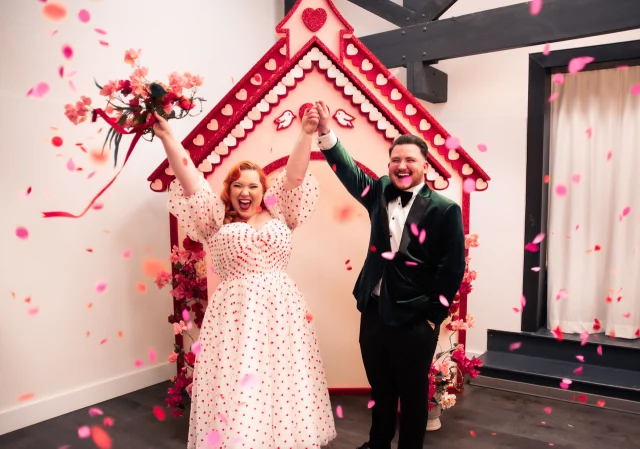 Not every love story needs a 200-person guest list.⁠
⁠
Photographer and founder of Lovebirds by Sherbet Birdie, Sasha Dobies, knows firsthand how powerful and personal a micro wedding can be, and she’s sharing her best tips in The Ultimate Guide to Planning a Micro Wedding on Polka Dot Wisdom today!⁠
⁠
From heartfelt vows to bright, joy-filled photos (yes, those are hers too!), this one’s for couples dreaming of a celebration that’s intimate, intentional, and unapologetically them.⁠
⁠
Tap the link in bio to read the full piece. ⁠
⁠
Photography: @sherbetbirdie_photography⁠
⁠
[Image description: A joyful couple celebrates in front of a whimsical wedding chapel backdrop. The bride is wearing a white dress adorned with red heart prints and puffed sleeves, holding a bouquet of pink flowers with red ribbons high in the air. She has red hair styled in soft curls and a beaming smile. The groom beside her is dressed in a dark green velvet tuxedo jacket with black pants, a white shirt, and a black bow tie. He is holding her hand triumphantly, smiling broadly. Behind them is a pink and red chapel structure decorated with heart motifs, white scalloped trim, and small red and white doves. Pink flower arrangements flank the chapel, and vibrant pink and red confetti petals are scattered in the air, enhancing the festive, romantic atmosphere.]⁠
⁠
#PolkaDotWedding #FeelGoodWeddings #AustralianWeddings #AustralianWedding #PolkaDotWisdom #WeddingPro #WeddingVendor #WeddingProfessional #WeddingInterview #Elopement #Elopements #AustralianElopement #Microwedding #Elope #WeddingTips #WeddingAdvice