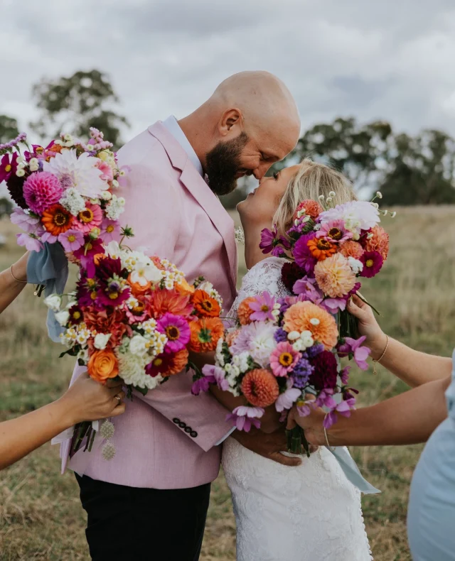 “Enjoy the moment, it is all over so quickly – soak it in.” – @jordiegarlick⁠
⁠
A farm wedding filled with love, laughter, and the sweetest nods to the past... Jordie & Ethne's relaxed country celebration is now live on Polka Dot Weddings – and it's as heartfelt as it is beautiful. ⁠
⁠
Tap the link in bio to see it all!⁠
⁠
Photographer: @essjayphotography / Beverages: @hellolucylou_ / Bride's Dress: @angelicinspirationsact / Catering: @bullnsmokebbq / Rental Furniture: @bespokecountryweddings / Hair & Makeup Artist: @jh_hairartistry / Hair & Makeup Artist: @bareskinandbeautyco / Ceremony Officiant: @shillobrations / Groom & Groomsmen Attire: @blowes_clothing / Venue: @atamarooroad⁠
⁠
[Image one description: Standing nose-to-nose, this couple are smiling at one another. The bridesmaids are holding their bouquets around the happy couple in a burst of pink, orange and purple florals. The groom is wearing a black suit with a pink jacket. The bride is wearing a fitted lace gown.⁠
⁠
Image two description: The bride is standing with her bridesmaids, who are all dressed in shades of light blue. They're all standing in tall grass on the bank of a lake.⁠
⁠
Image three description: As the sun sets, the newlyweds make the most of the golden hour with their photographer. The groom holds onto his bride's waist as he leans down to nuzzle into her cheek. She has her hands on his arms with her eyes closed in bliss.]⁠
⁠
⁠
#PolkaDotWedding #FeelGoodWeddings #AustralianWeddings #AustralianWedding #WeddingStory #WeddingStories #WeddingMemories #WeddingInspiration #WeddingInspo #RealWedding #CountryWedding #RelaxedWedding