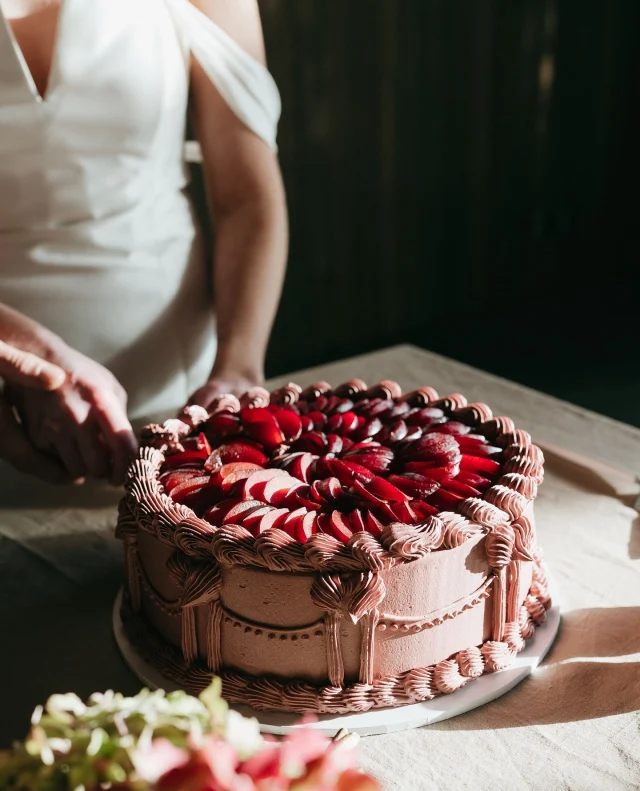Sustainability never looked so glamorous.⁠
⁠
This romantic Central Otago shoot brings together locally grown florals, vineyard charm and luxurious textures – all set at Alexandra’s stunning new venue @thefinerynz.⁠
⁠
Shoot live now on Polka Dot Featured!⁠
⁠
Photographer: @melissaclarkphotos / Wedding Planner/Stylist: @dreamtowed / Ceremony Officiant: @dreamtowed / Cinematographer: @kristamayweddings / Venue: @thefinerynz / Jewellery: @jamiesjewellers / Transport: @muzz_and_molly / Flowers: withloveflowers_vania / Signage: @_smittenwithlove / Hair & Makeup Artist: @oswin.charlie / Linens: @drape.linen / Wedding Cake: @shebakesnz / Rental Furniture: @wanakamarqueepartyhire / Accommodation: @willowbrookretreat / Bride’s Dress: @margaretwraybridal / Groom’s Attire: @vanheusenstyle / Bride’s Shoes: @merchant1948 ⁠
⁠
[Image one description: A beautiful red iced cake with red sliced plums lining the top layer. The cake and table it’s on are bathed in streams of sunlight, with a bride out of focus in the background cutting into the cake.⁠
⁠
Image two description: Standing in front of a lavishly decorated table with white linens is this couple kissing. The bride is wearing an off-shoulder fitted gown with her hair in an updo. She has one hand resting on the groom’s elbow and the other holding her red and green bouquet over his shoulder. The groom is wearing a classic black suit with a mini version of the bouquet on his buttonhole.⁠
⁠
Image three description: A closer look at the table, lit with romantic candles and overflowing with droopy red and brown florals. The table is covered in white linens, with crystalware lining each place setting. White and black plates sit with pink napkins at each chair.]⁠
⁠
⁠
#PolkaDotWedding #FeelGoodWeddings #AustralianWeddings  #WeddingInspiration #RomanticWedding #AutumnalWedding #AutumnWedding #Wedding #Weddings #WeddingInspo #StyledShoot #AustralianWedding #WeddingStyle #CreativeWedding #WeddingIdeas #WeddingBlog #NewZealandWeddingInspo #NewZealandWedding