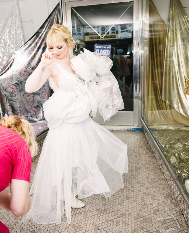 If the dress no longer serves you – cut it! ⁠
⁠
"I had a slight idea to do this earlier, knowing I wouldn’t likely wear it again, and if I did cut it, I wouldn’t need a specific reception dress. But the temperature just made that decision for me," shared Sophie.⁠
⁠
Photographer: @itsbeautifulhere⁠
⁠
[Image descriptions: These three photos depict the bride standing as her dress length is cut to a breathable ankle length, while holding up the offcuts in relief. The final shot shows her happily swaying with the dress cut above her ankles.]⁠
⁠
#PolkaDotWedding #FeelGoodWeddings #AustralianWeddings #AustralianWedding #WeddingInspiration #WeddingInspo #WeddingDetails #UniqueDetails #WeddingDetail #DressCutting #WeddingDressCutting
